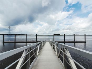 Pier over sea against sky