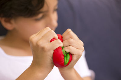 Close-up of boy squeezing toys