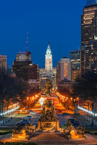 Statue of illuminated buildings at night