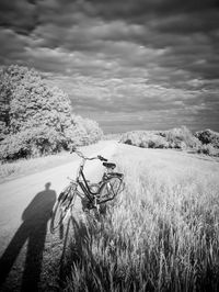 Bicycle on field against sky