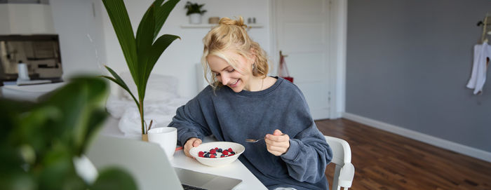 Side view of woman using mobile phone