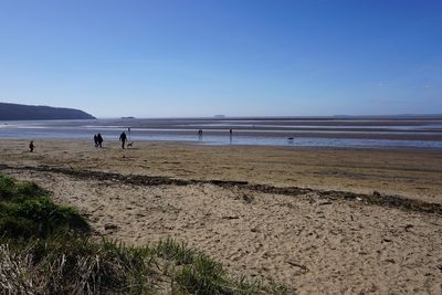 Scenic view of beach against clear sky