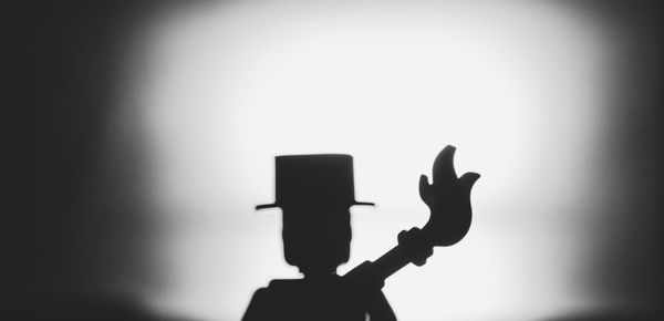 Silhouette man standing at music concert