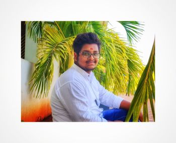 Portrait of young man standing outdoors