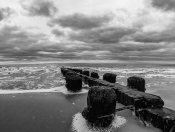 Scenic view of sea against cloudy sky