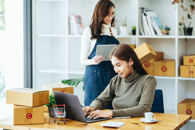 Young woman using laptop at home