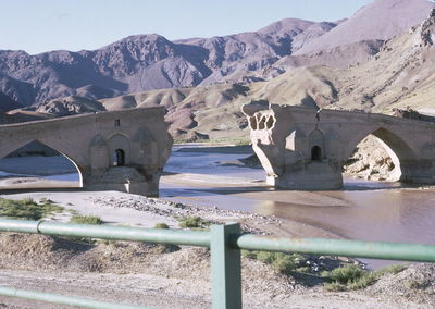 View of landscape with mountain range in background