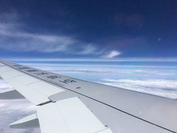 Airplane wing against sky