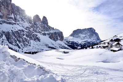 Scenic view of snow covered mountains against sky
