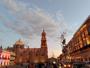 View of buildings in city against sky