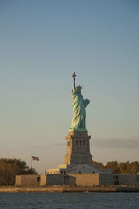 Statue of liberty against sky during sunset