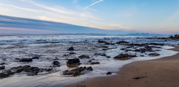 Scenic view of sea against sky during sunset