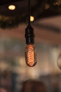 Close-up of hanging light against blurred background