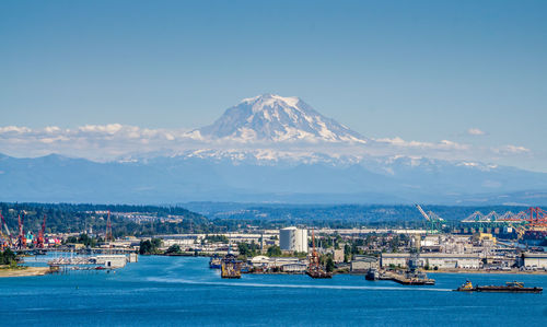 Mount rainier with little snow in summer and the port of tacoma.