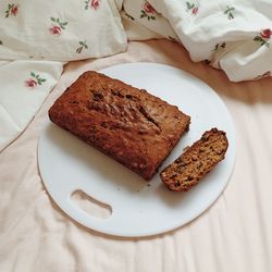 Close-up of food in plate on bed 