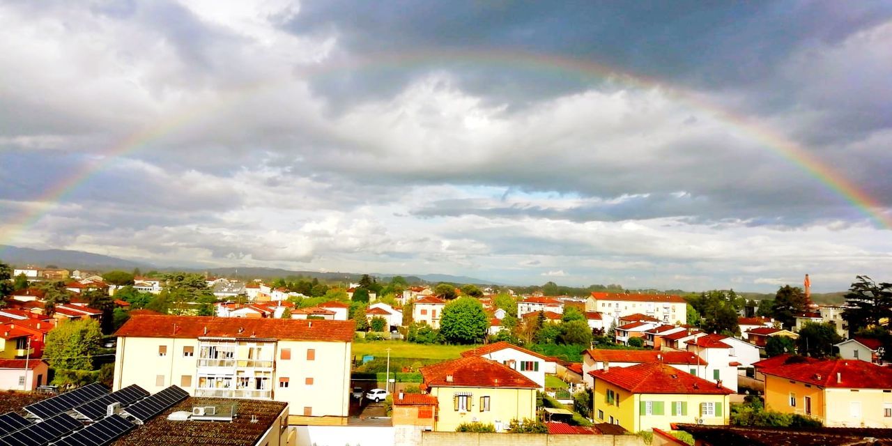 architecture, built structure, cloud - sky, building exterior, building, residential district, rainbow, sky, city, house, nature, no people, day, outdoors, town, plant, roof, high angle view, multi colored, cityscape, townscape