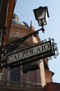 Low angle view of street light against building