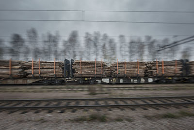 Train transporting timber, departing from mora in dalarna, north of sweden.