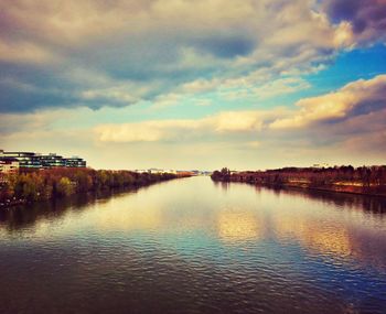 Scenic view of river at sunset