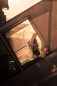 High angle view of people standing by window