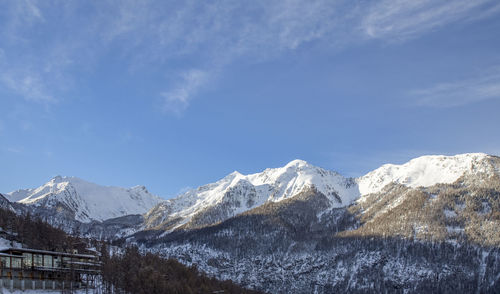 Scenic view of snowcapped mountains against sky