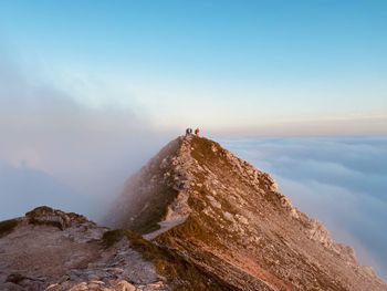 Rock formations on mountain against sky