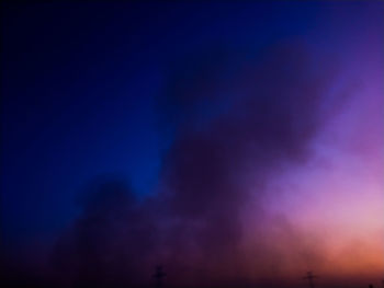 Low angle view of cloudy sky at night