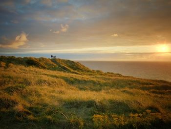 Scenic view of sea against cloudy sky