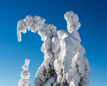 Low angle view of statue against sky