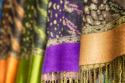 Close-up of multi colored decorations hanging on wall