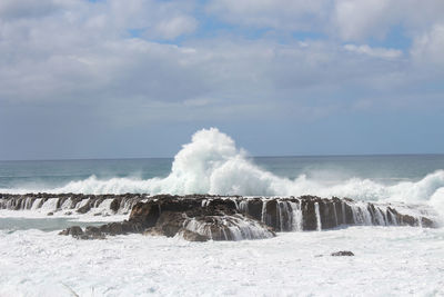 Waves crashing on rocks oahu hawaii