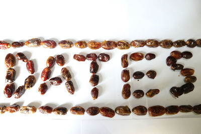 Close-up of coffee beans against white background