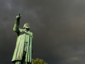 Low angle view of statue against sky