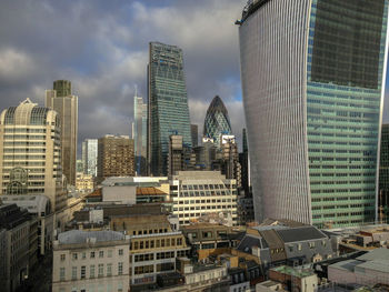 Modern buildings in city against sky