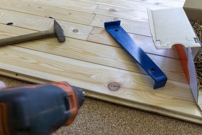 High angle view of person on wooden floor at home