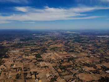 Aerial view of agricultural field against sky