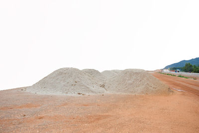 Scenic view of desert against clear sky