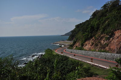 High angle view of road by sea against sky