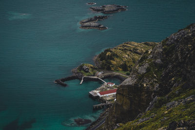 High angle view of rocks on sea shore