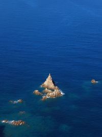 High angle view of rocks in sea