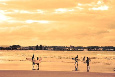 Silhouette of people on beach