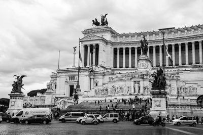 Low angle view of statue against cloudy sky