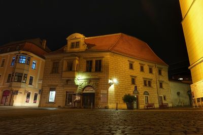 Low angle view of illuminated buildings at night