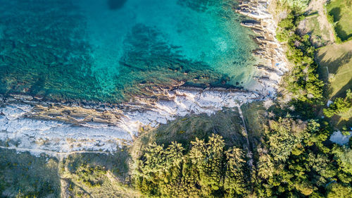 High angle view of water flowing through rocks