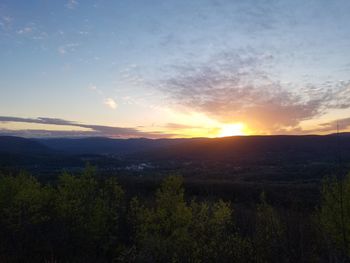 Scenic view of landscape against sky during sunset