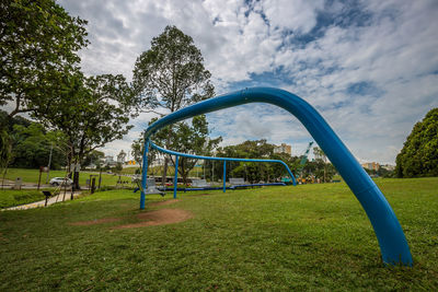 Trees in park against sky
