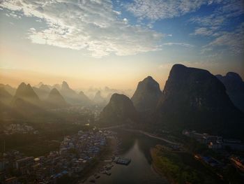 Aerial view of city buildings at sunset