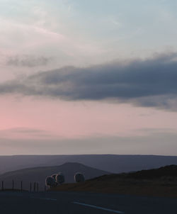 Scenic view of field against sky at sunset