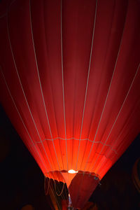 Low angle view of illuminated lights at night