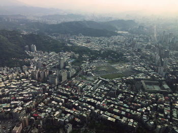 High angle view of city buildings against sky